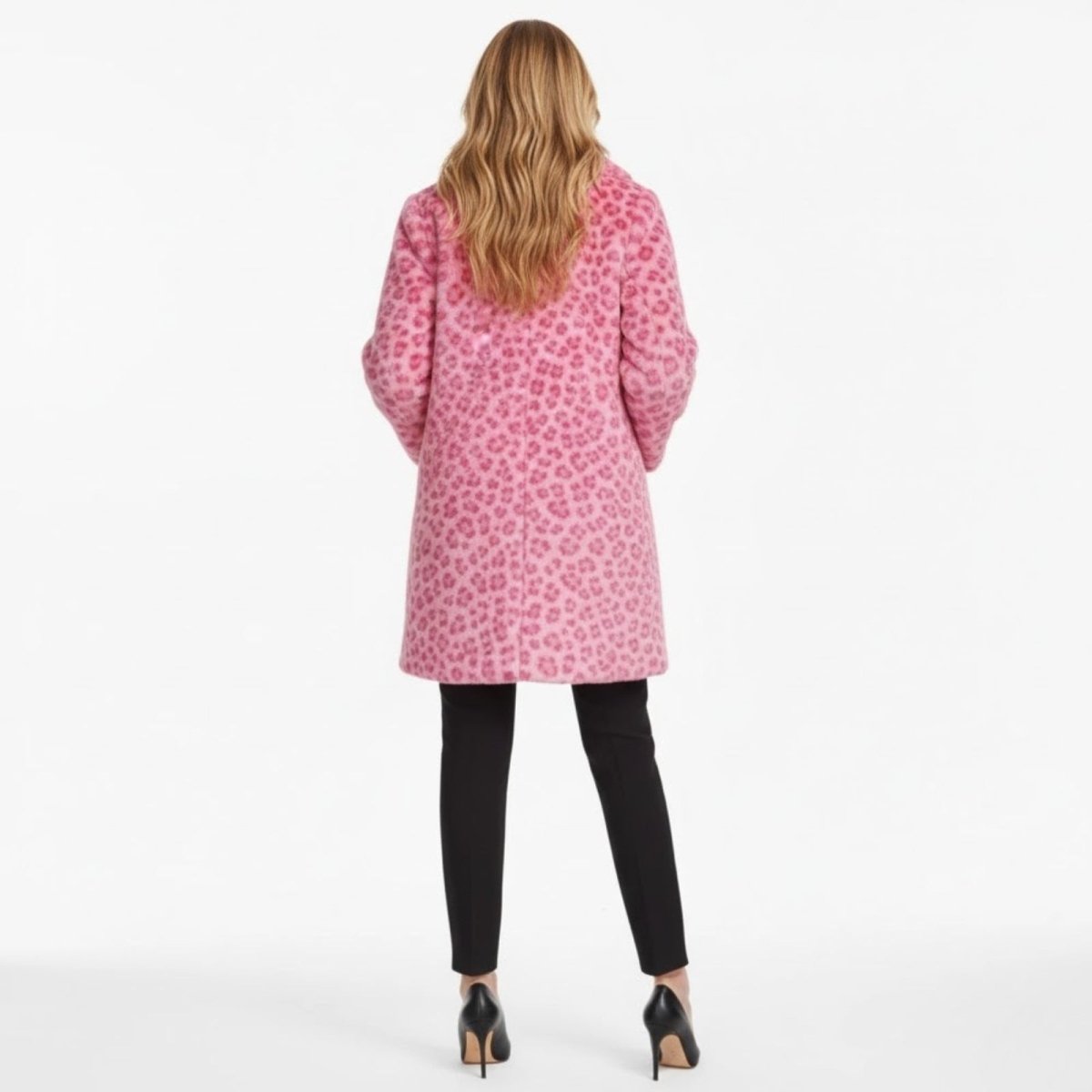 Back view of a model with long blonde hair wearing the Kouvr Jovi pink leopard print coat.