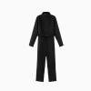 Flat lay of the Kouvr Junnie black technical jumpsuit showing the front zipper, chest pocket, and belt buckle detail.