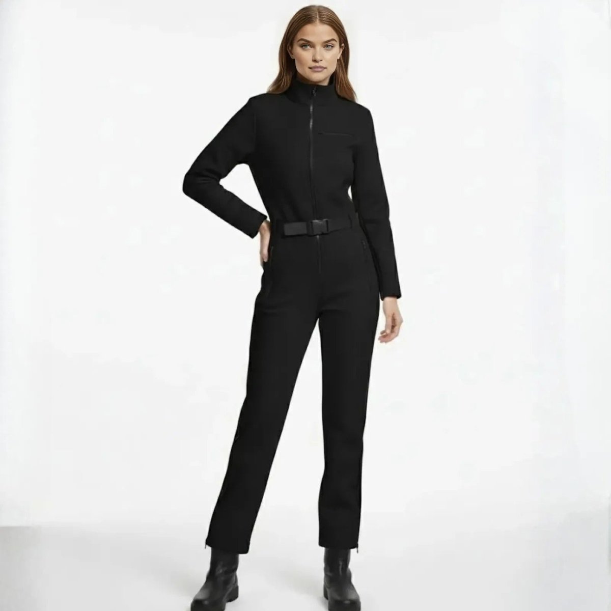 Model wearing the Kouvr Junnie black belted long sleeve jumpsuit with a mock neck and front zipper.