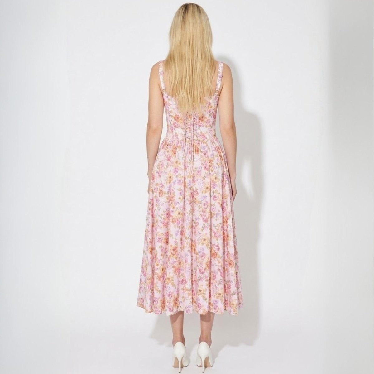 Back view of the Kallirroi dress highlighting the adjustable lace-up corset detail over the cinched waist.