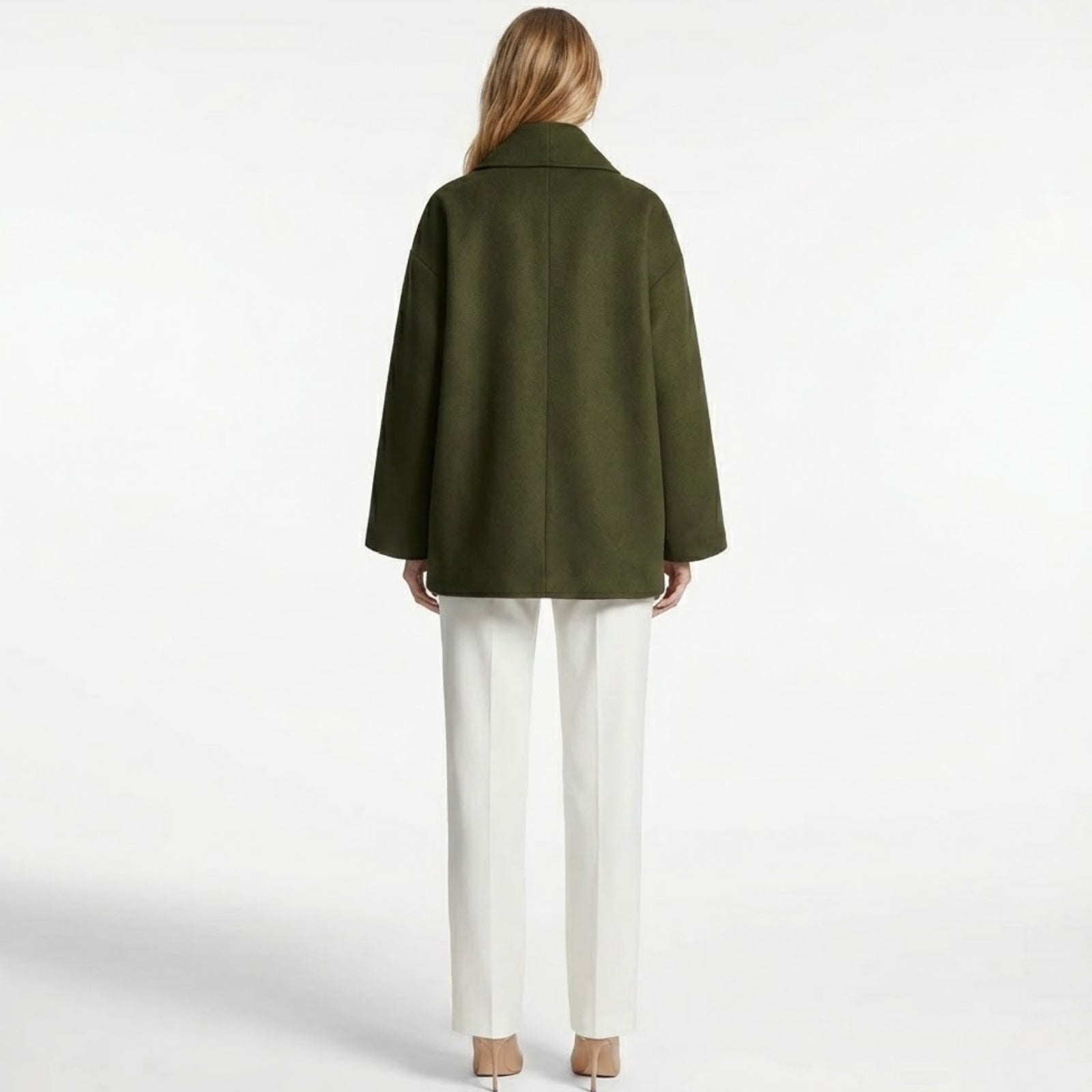 Back view of the Kouvr Katherine oversized wool coat in green, highlighting the clean lines and minimalist design.