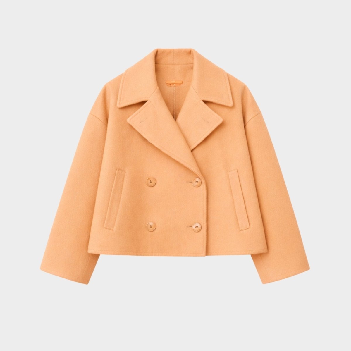 Detail shot of the back and central seam work on the Kouvr Katherine cropped wool jacket, showing the quality of the tailoring.