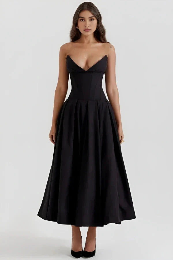 Model wearing Kouvr Fashion's black strapless corset midi dress for a formal event