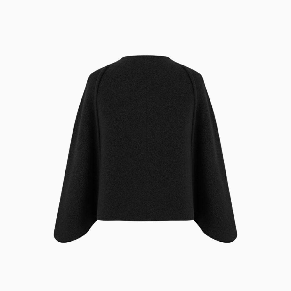 Product flat lay showing the back of the Kouvr Laverne black cropped capelet, detailing its construction and shape.