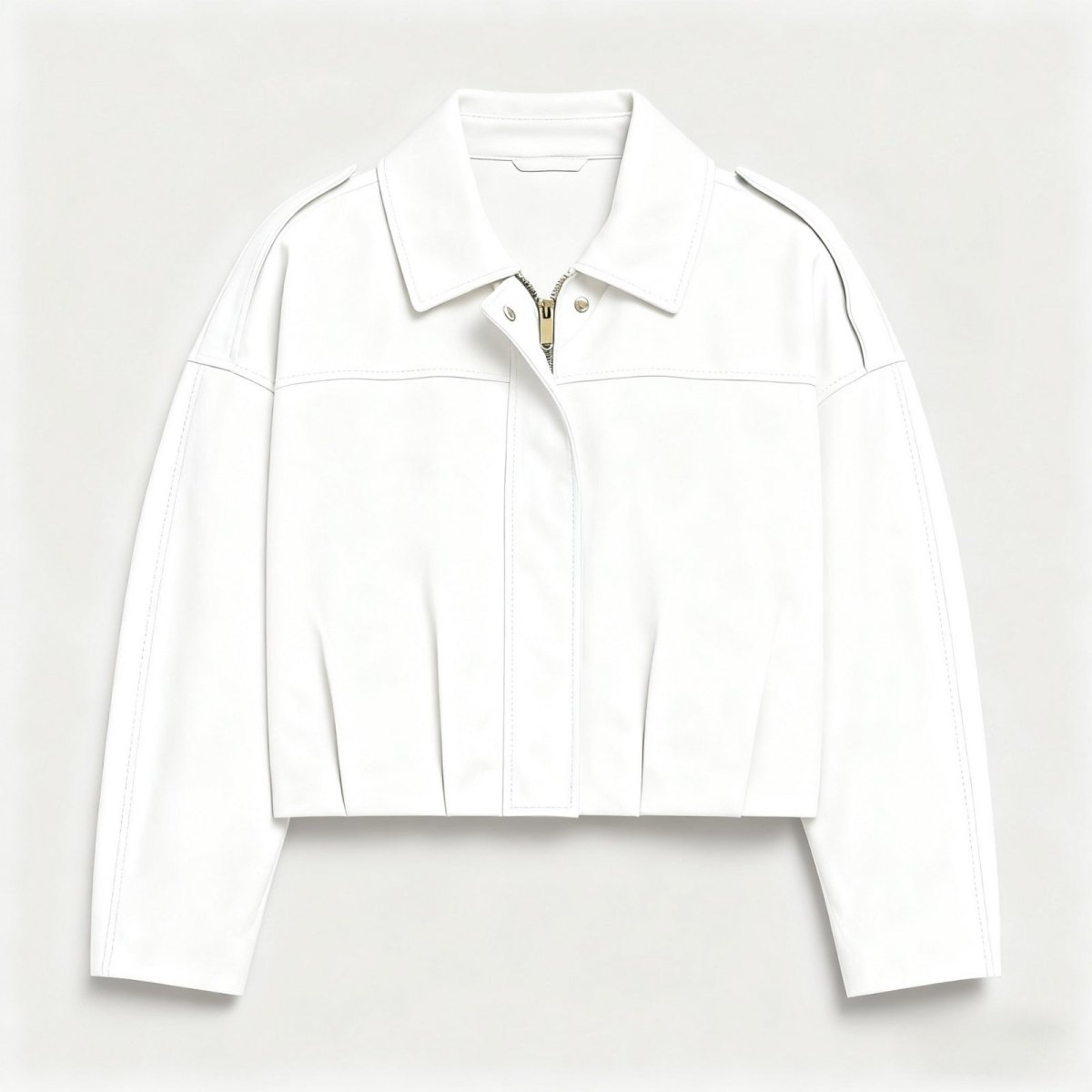 Close-up detail of the gold-tone zipper and collar on the Kouvr Leilani white faux leather jacket.