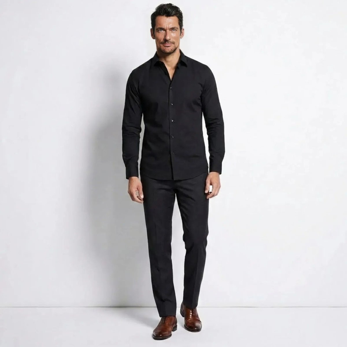 Kouvr Leland Slim Fit Dress Shirt in Black shown from the front on a model.