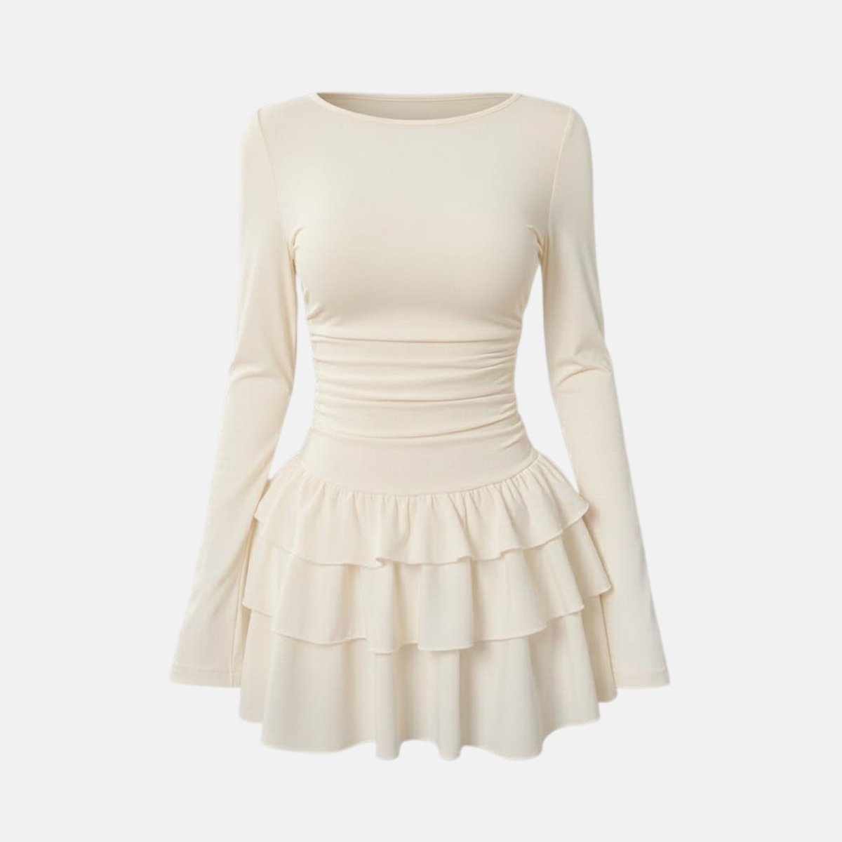 Product flatlay of the Kouvr Leona cream long sleeve dress showing the ruched waist and ruffle details.