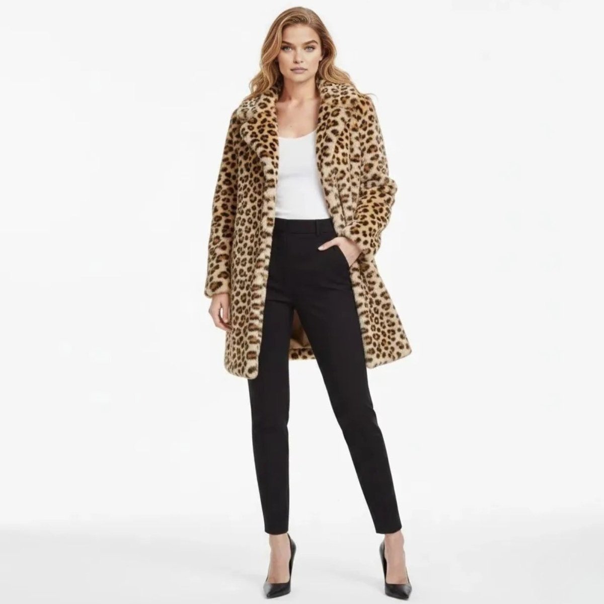 Model wearing the Kouvr Fashion leopard print faux fur coat front-on, styled with black pants and a white top.