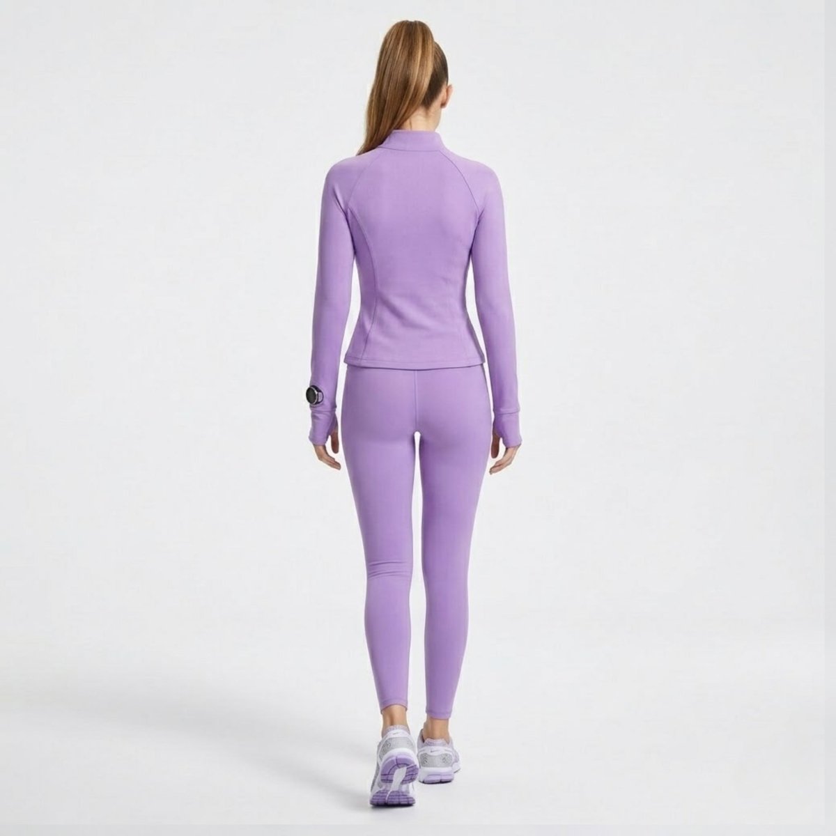 Back full length view of luxury athletic jacket and matching leggings in light purple.