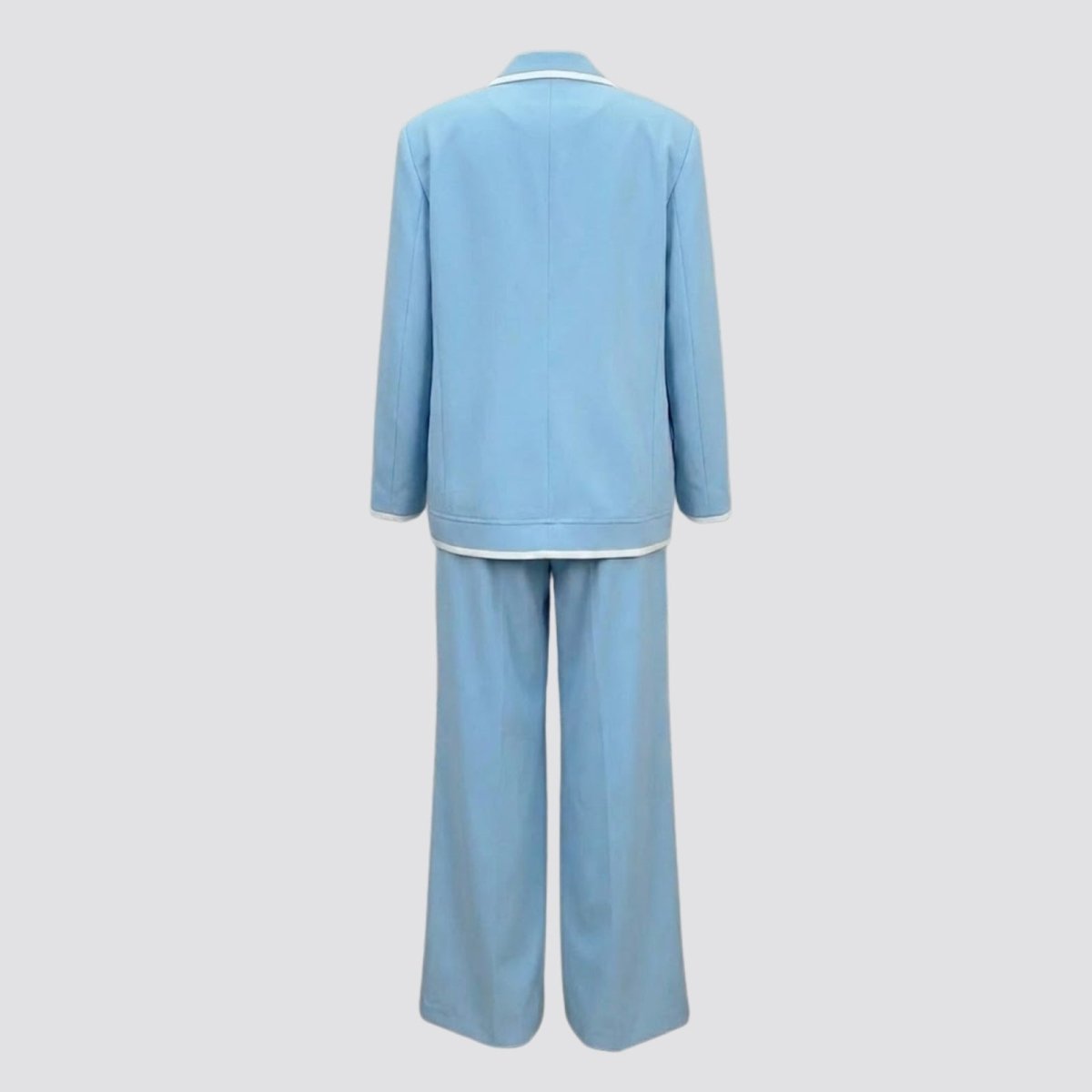 Flat lay studio shot of the back of the Kouvr Lucia Set sky blue blazer and trousers, showing the quality construction and tailoring.
