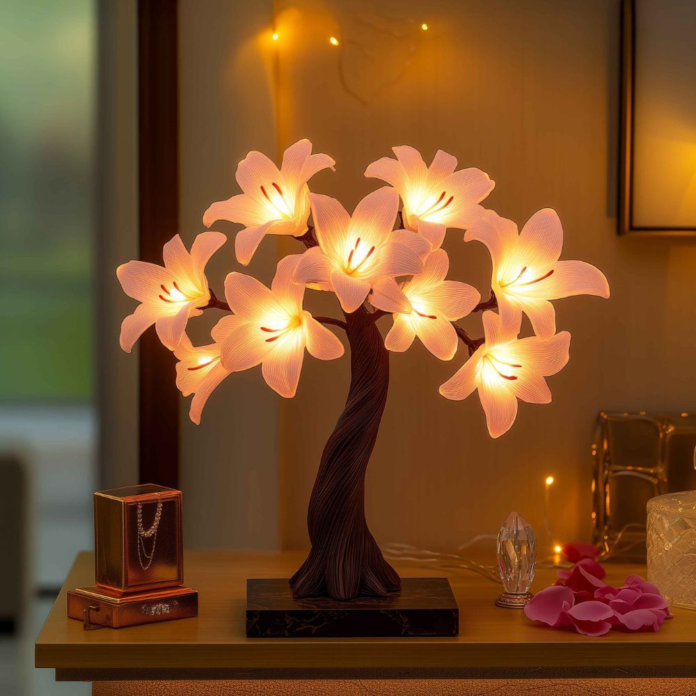 Kouvr Starfall Lily Tree in Luminous providing ambient light on a modern wooden desk at night