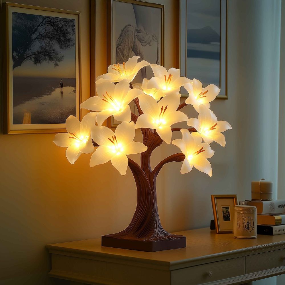Kouvr Starfall Lily Tree in Luminous providing ambient light on a modern wooden desk at night