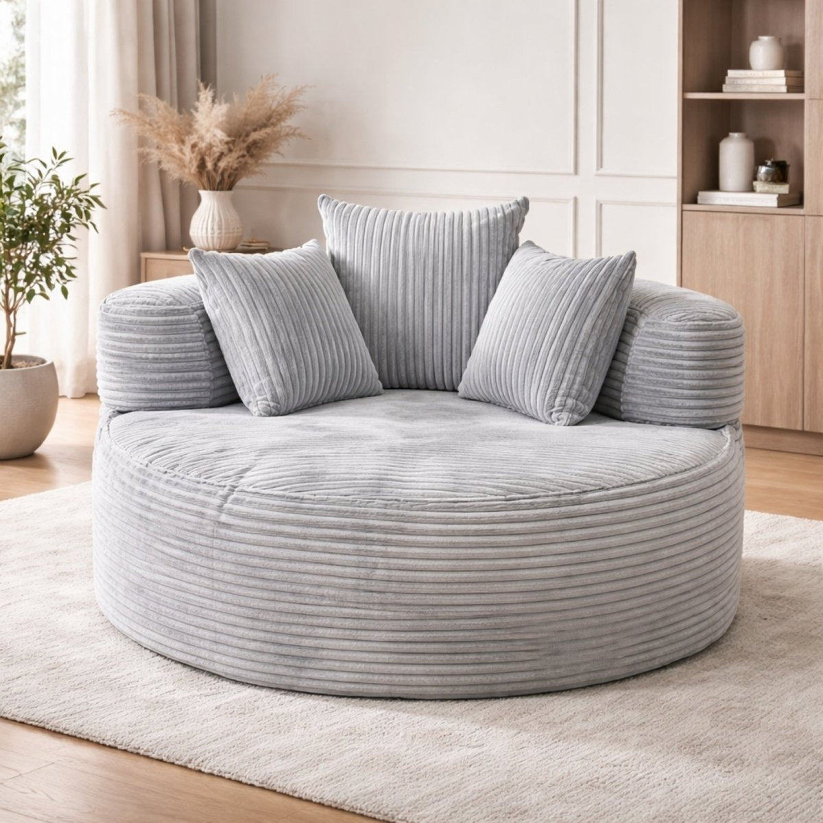 Light grey corduroy round swivel chair, minimal aesthetic, large comfortable barrel chair for contemporary home decor.