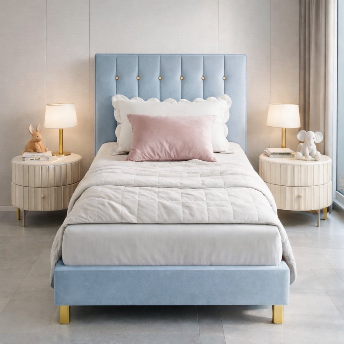 Front view of Kouvr powder blue velvet twin bed frame with vertical channel tufted headboard, styled with white bedding and gold lamps in a modern kids room.