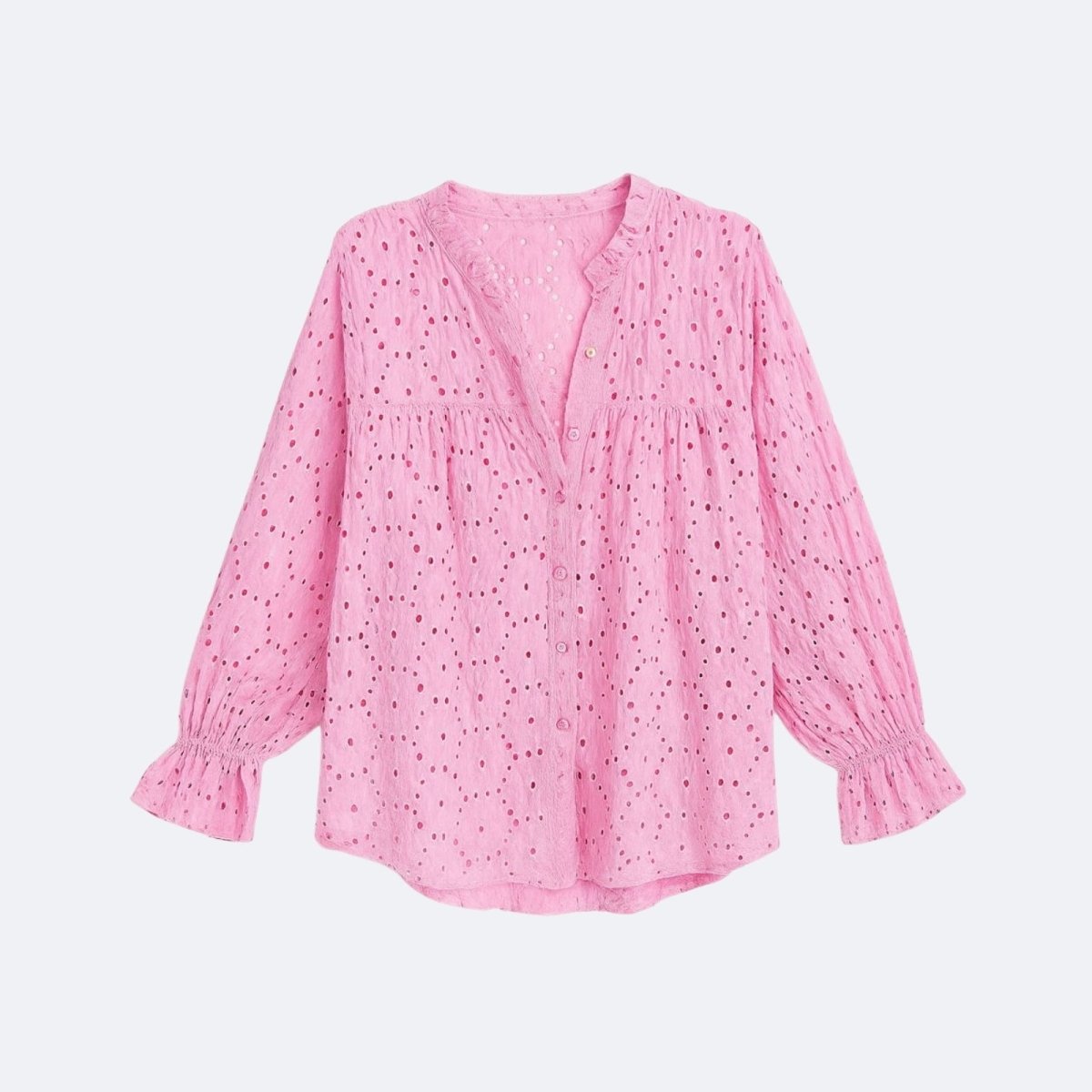 Flatlay product shot of the front of the Kouvr pink eyelet blouse, showing the ruffled collar, button placket, and ruffled cuffs.