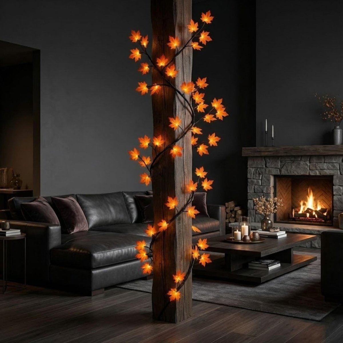 The flexible Illuminated Maple Branch Vine Wisp wrapped organically around a rustic wooden support beam in a chic living room with a black leather sofa.
