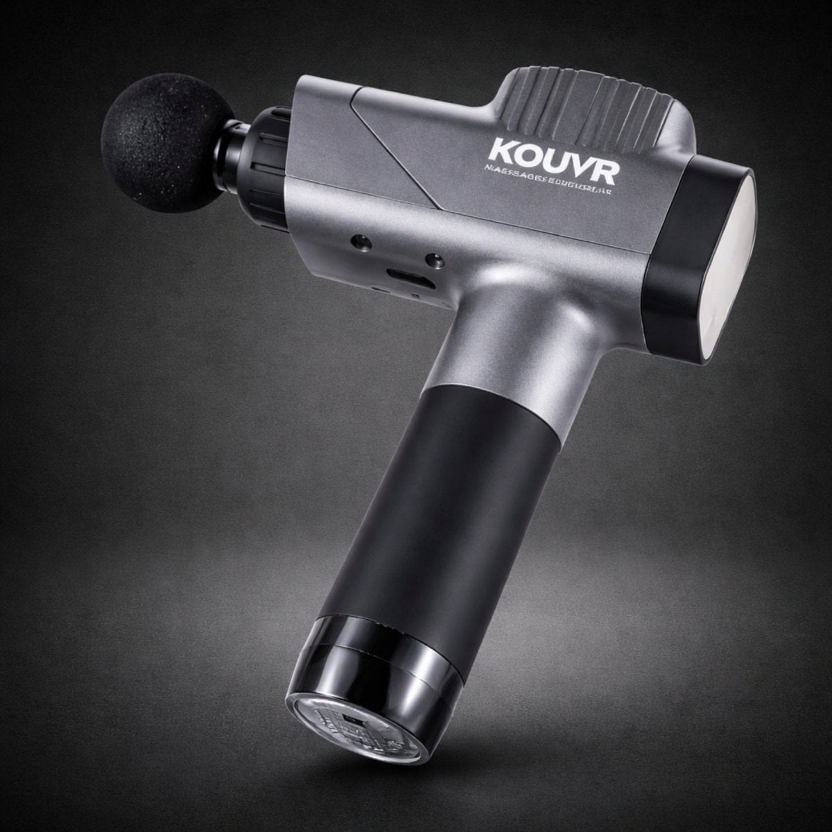 Angled upright view of the sleek Kouvr percussion muscle massager resting on its base
