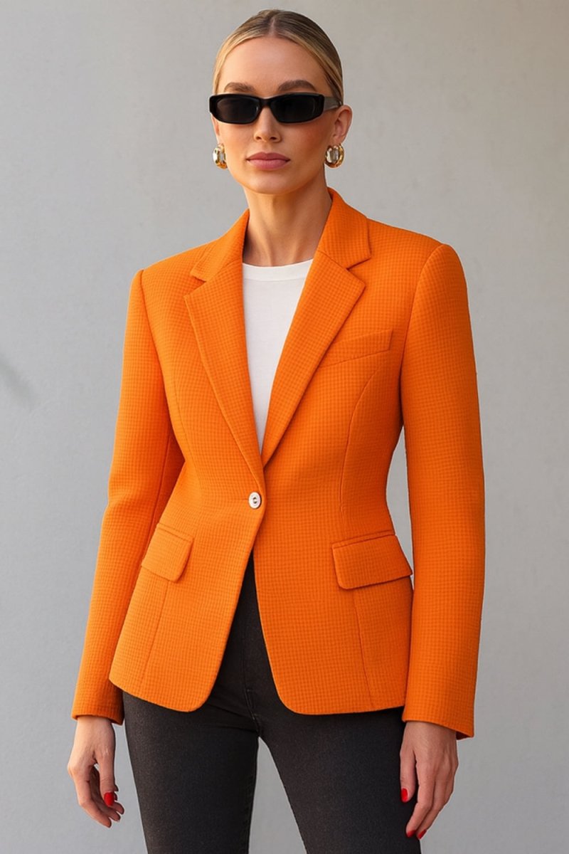single-breasted tailored jacket," "vibrant orange power blazer," "luxury workwear for women," "statement office jacket," "basket-weave fabric," "impeccable tailoring," "transitional outerwear," "professional women's clothing