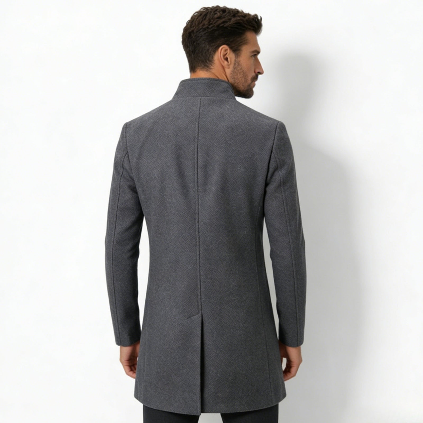 Back view of the Kouvr Fashion men's charcoal grey winter coat, showing the structured shoulders and single vent detail.
