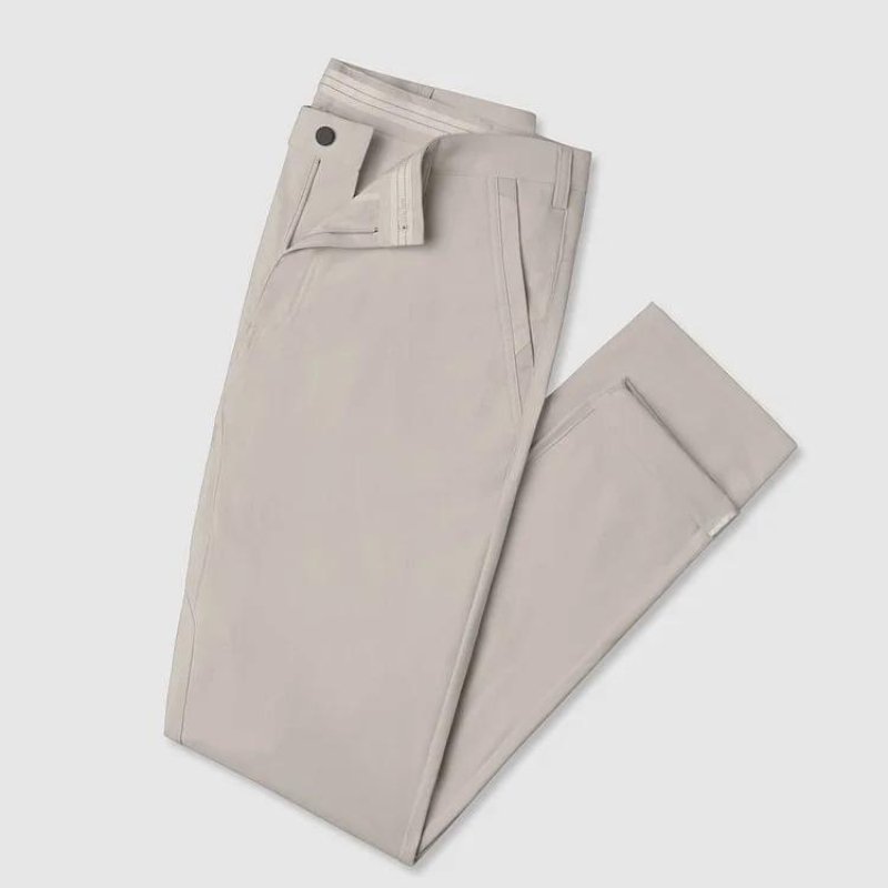 Kouvr All-Day Commuter Pants in khaki folded on a white background