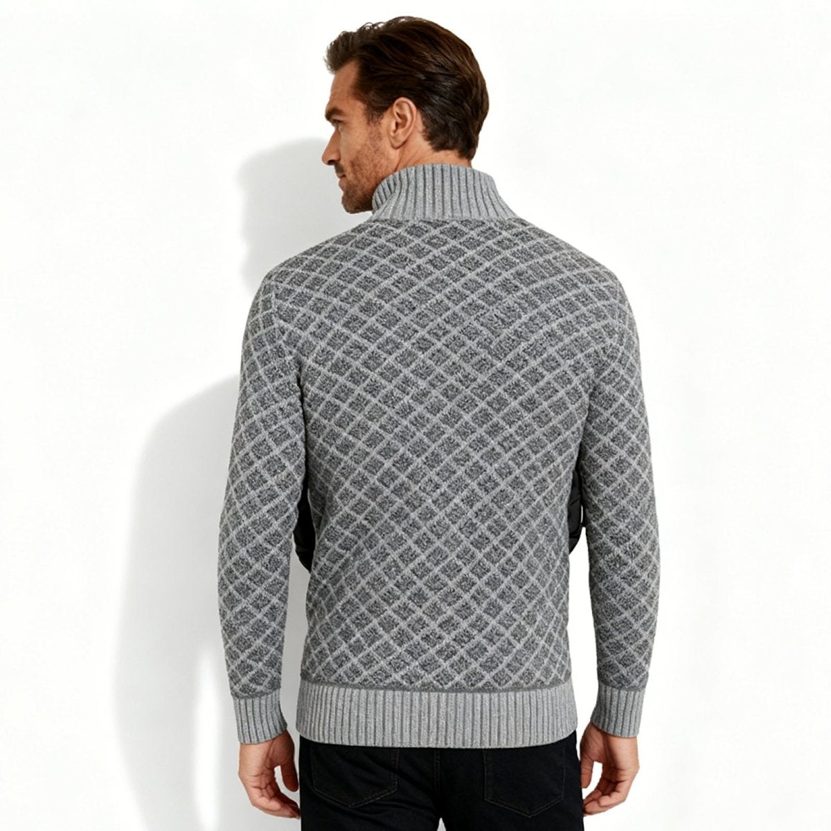 Back view of a male model showing the detailed diamond knit pattern on the Kouvr full-zip cardigan sweater.
 