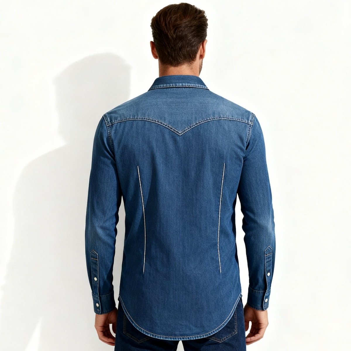 Man wearing a Navy blue Kouvr denim shirt on a white background