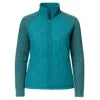 Model wearing the Kouvr Mika Hybrid Bomber Jacket in Aegean Teal, featuring cable-knit sleeves and a diamond-quilted body, paired with light-wash skinny jeans