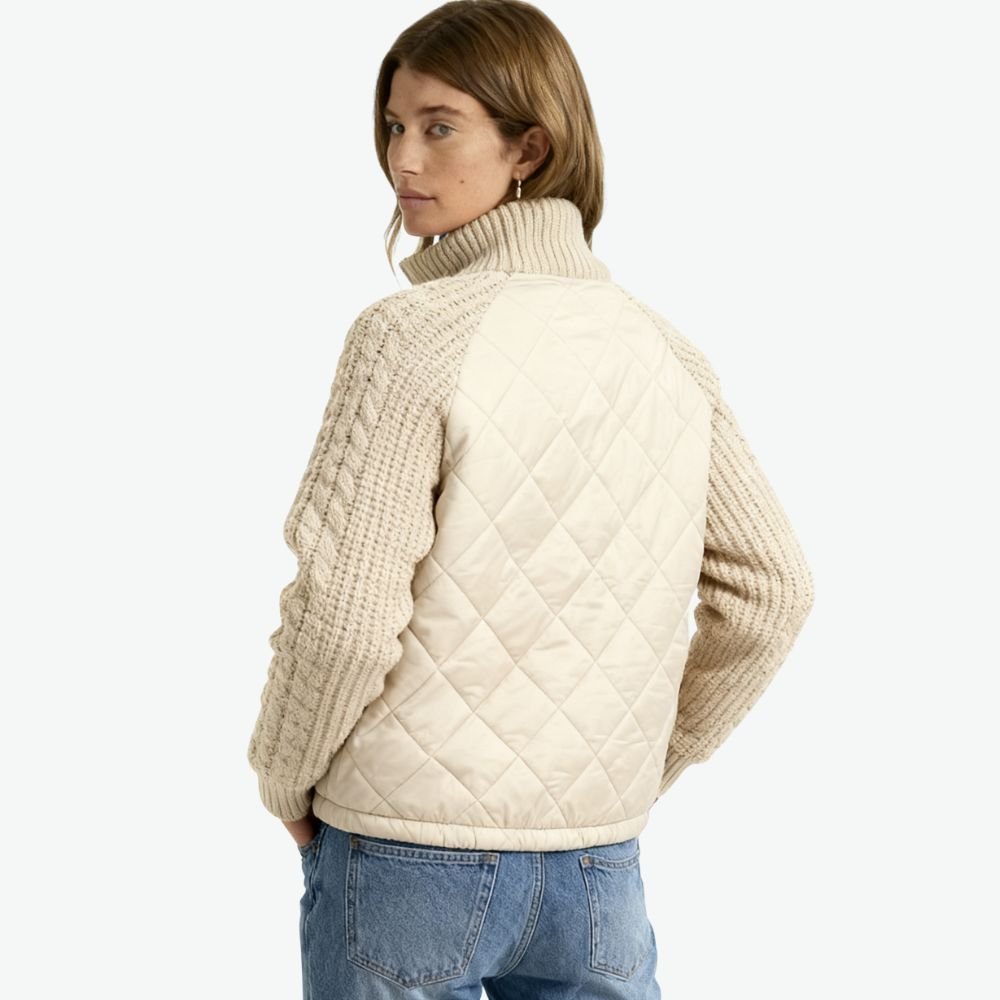 Model wearing the Kouvr Arlington Quilted Hybrid Jacket with blue jeans