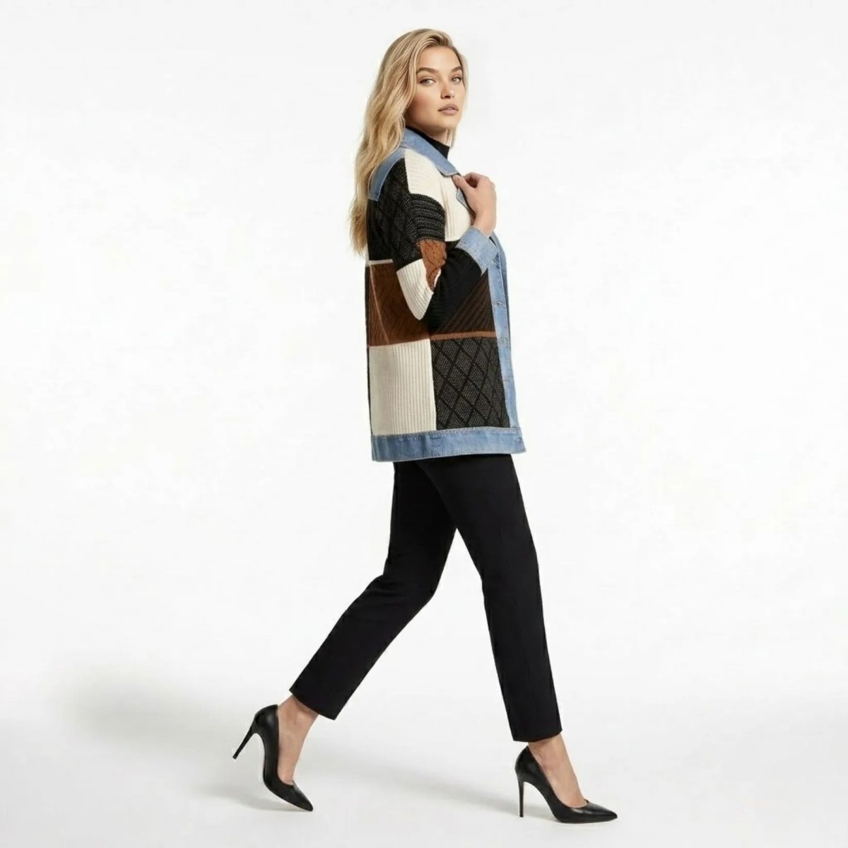 Side view profile of model walking in Kouvr longline mixed media knit sweater coat and denim shacket.