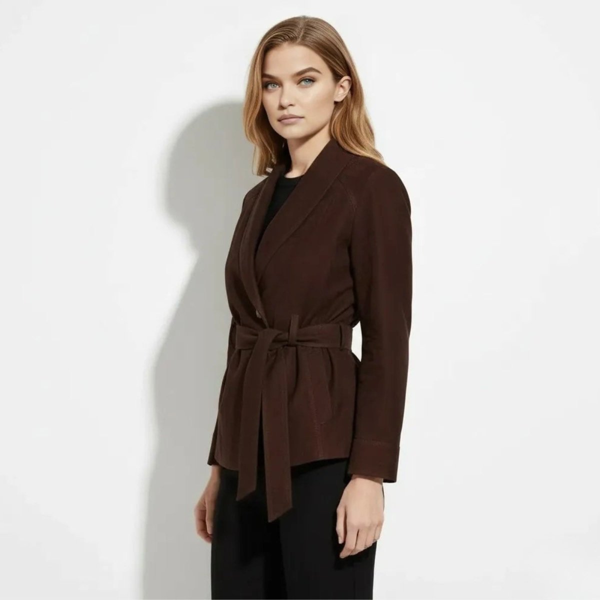 Model showing the side profile and silhouette of the Kouvr Myla shawl collar suede jacket in chocolate brown.
