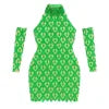 Model wearing Kouvr's Myra green crystal embellished long sleeve dress with cold shoulder cut-outs and an open back