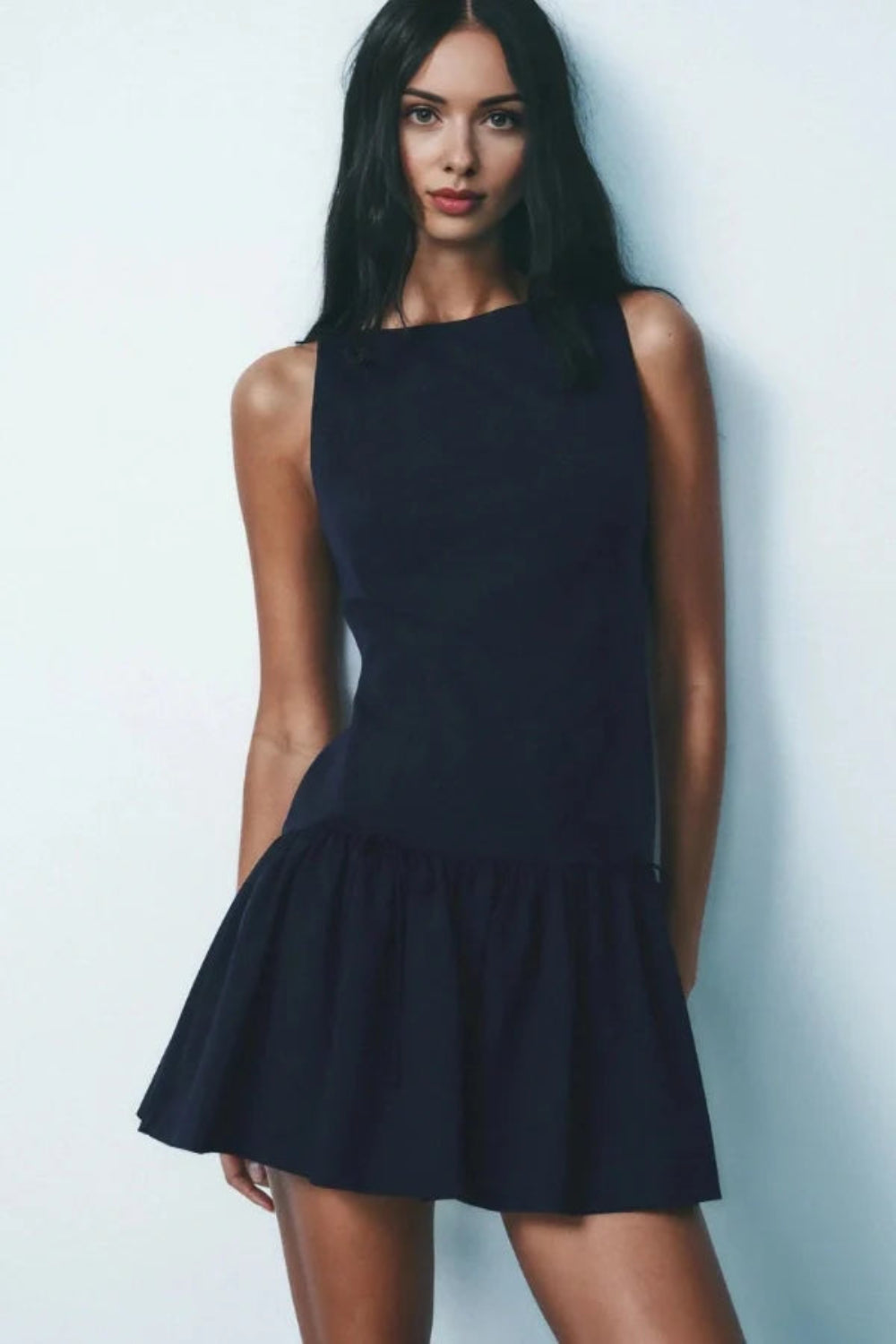 sculptural dress', 'structured poplin dress', 'modern A-line dress', 'dress with boots outfit', 'designer party dress