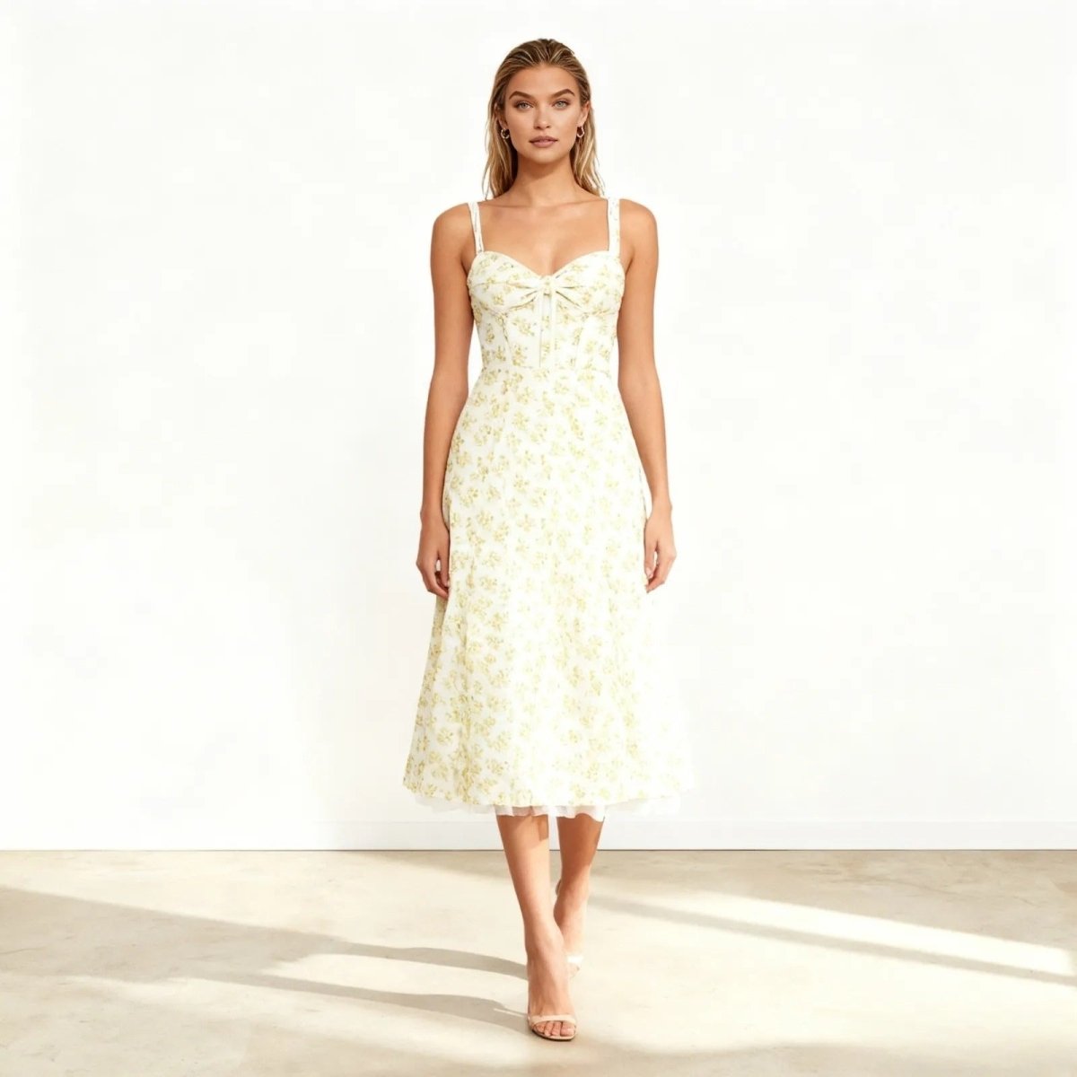 Woman wearing a white floral dress on a white background