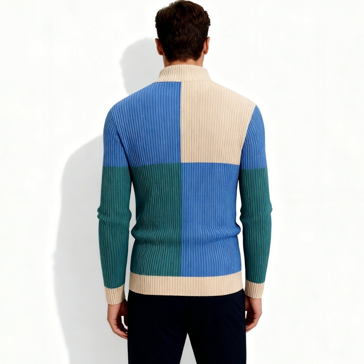 Back view of the Kouvr Nerthus men's mock neck sweater displaying the quadrant color block design in blue, green, and cream.