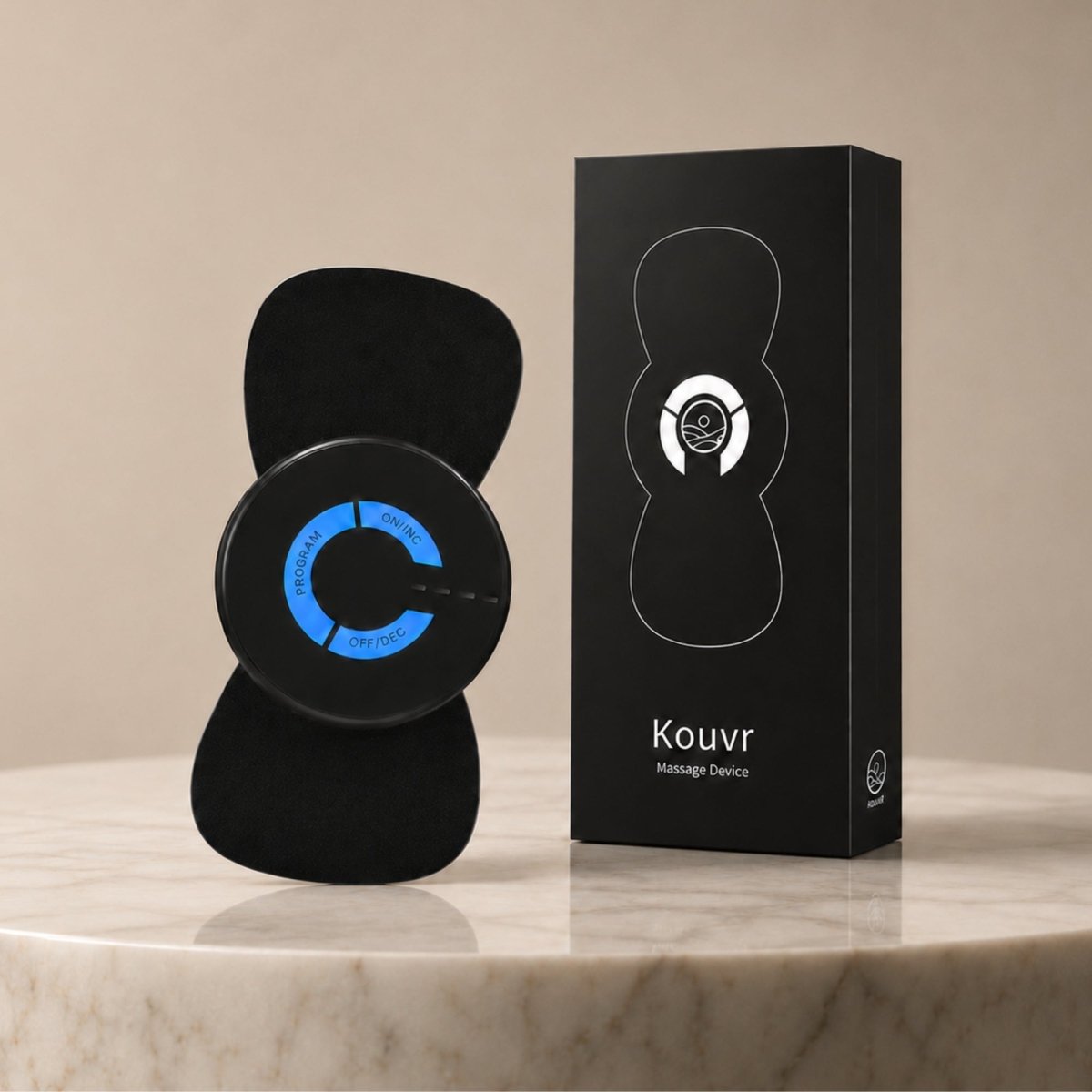 Premium black box packaging and sleek wireless Kouvr NeuroPulse spine and muscle restorative massager resting on a luxury marble surface.
