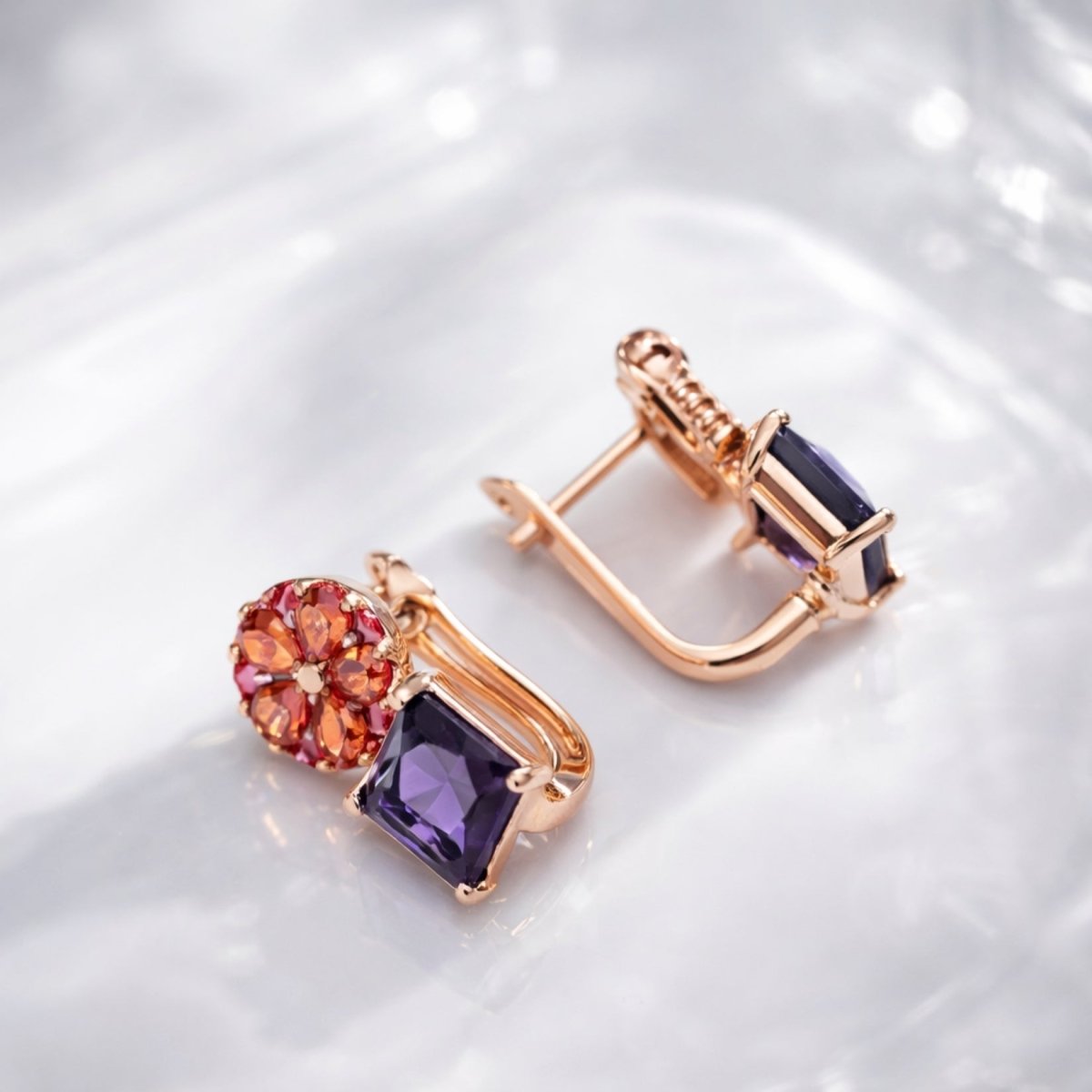Side and back view of the Kouvr Octivia amethyst drop earrings showing the secure English lock leverback clasp and rose gold setting.
