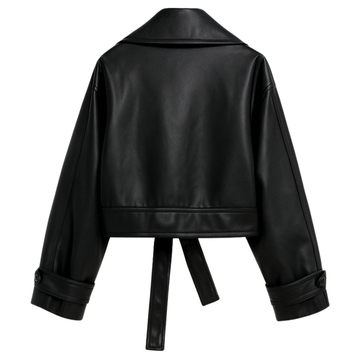 Model wearing the Kouvr Patricia women's cropped black faux leather trench jacket with a tie belt