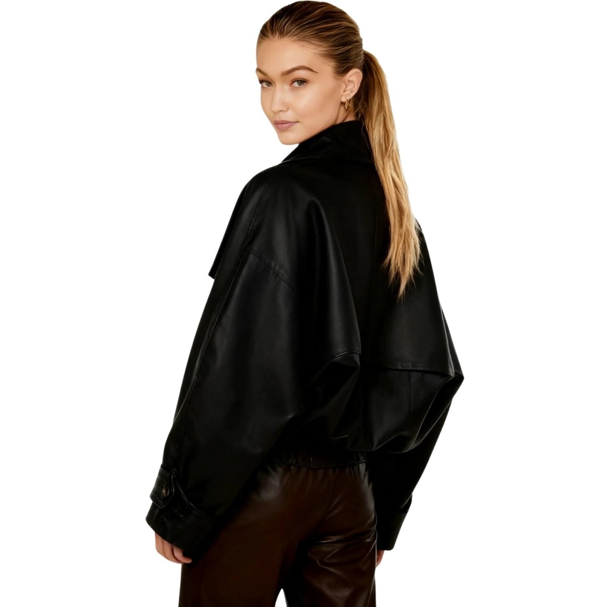Woman wearing a black kouvr jacket on a white background