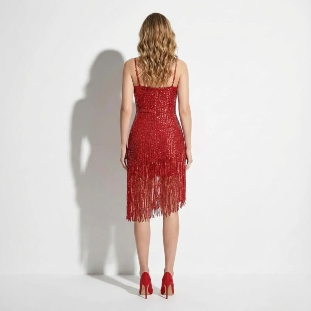 Back view of the Kouvr Phaedra red sequin dress showing the straight neckline and full sequin coverage on the back panel.