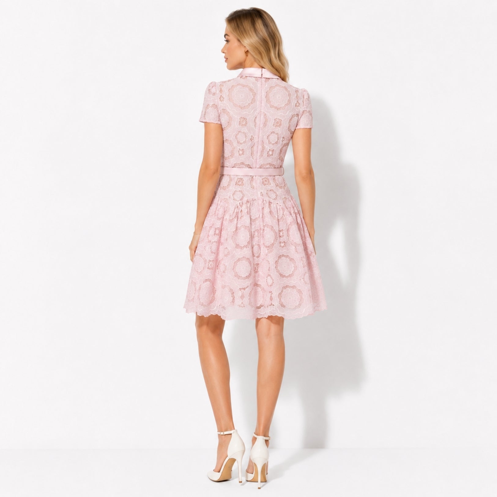Back view of Kouvr pink lace short dress showing concealed back zipper and scalloped hemline.