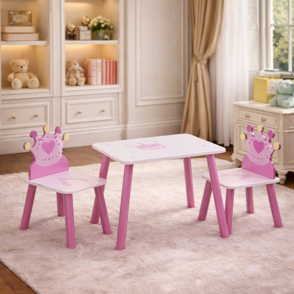 A full view of the Kouvr kids princess table and two chairs set up on a cream-colored rug in a bright, elegant child's room.