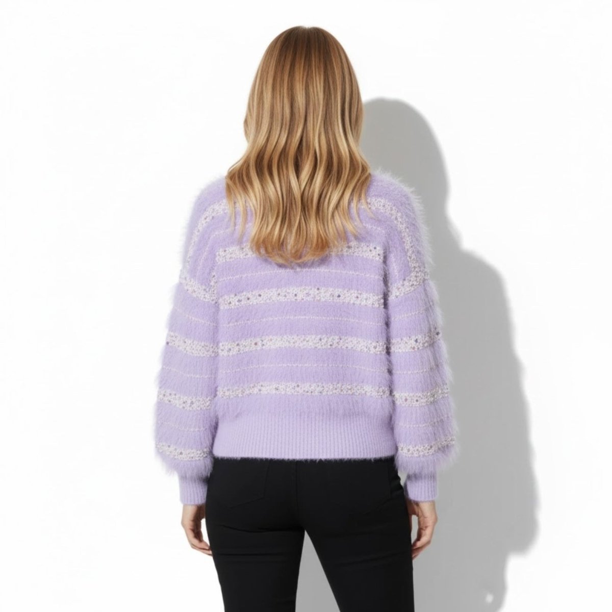 Back view of the Kouvr purple eyelash knit sweater, showing the horizontal textured stripe pattern.