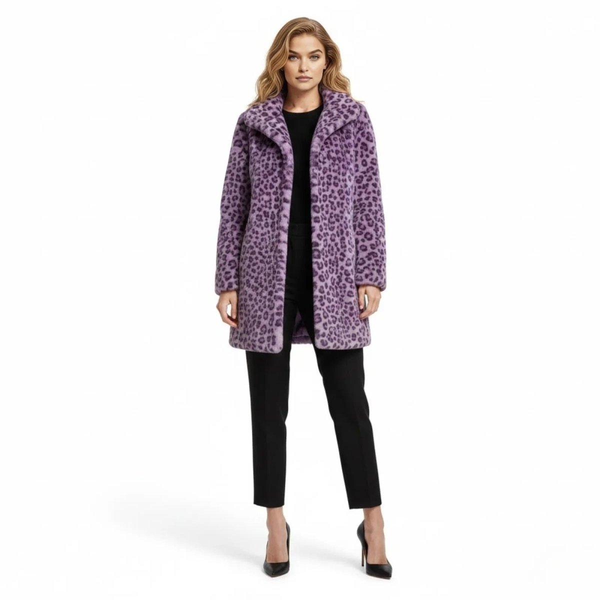 Model facing forward wearing the Kouvr purple leopard print faux fur coat, styled with black trousers and black high heels on a white background.