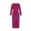 Model walking in Kouvr's red floral long sleeve wrap midi dress