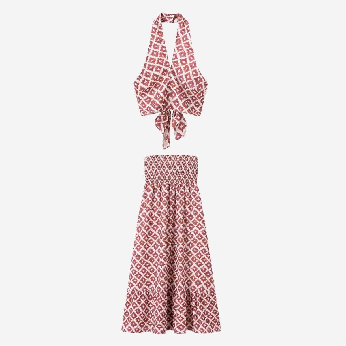 Studio flat lay of Kouvr red patterned matching set featuring wrap halter top and tiered midi skirt front view.