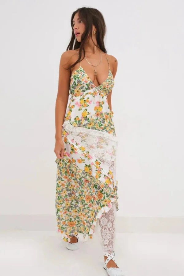 Model wearing Kouvr Fashion floral and lace maxi dress with open back