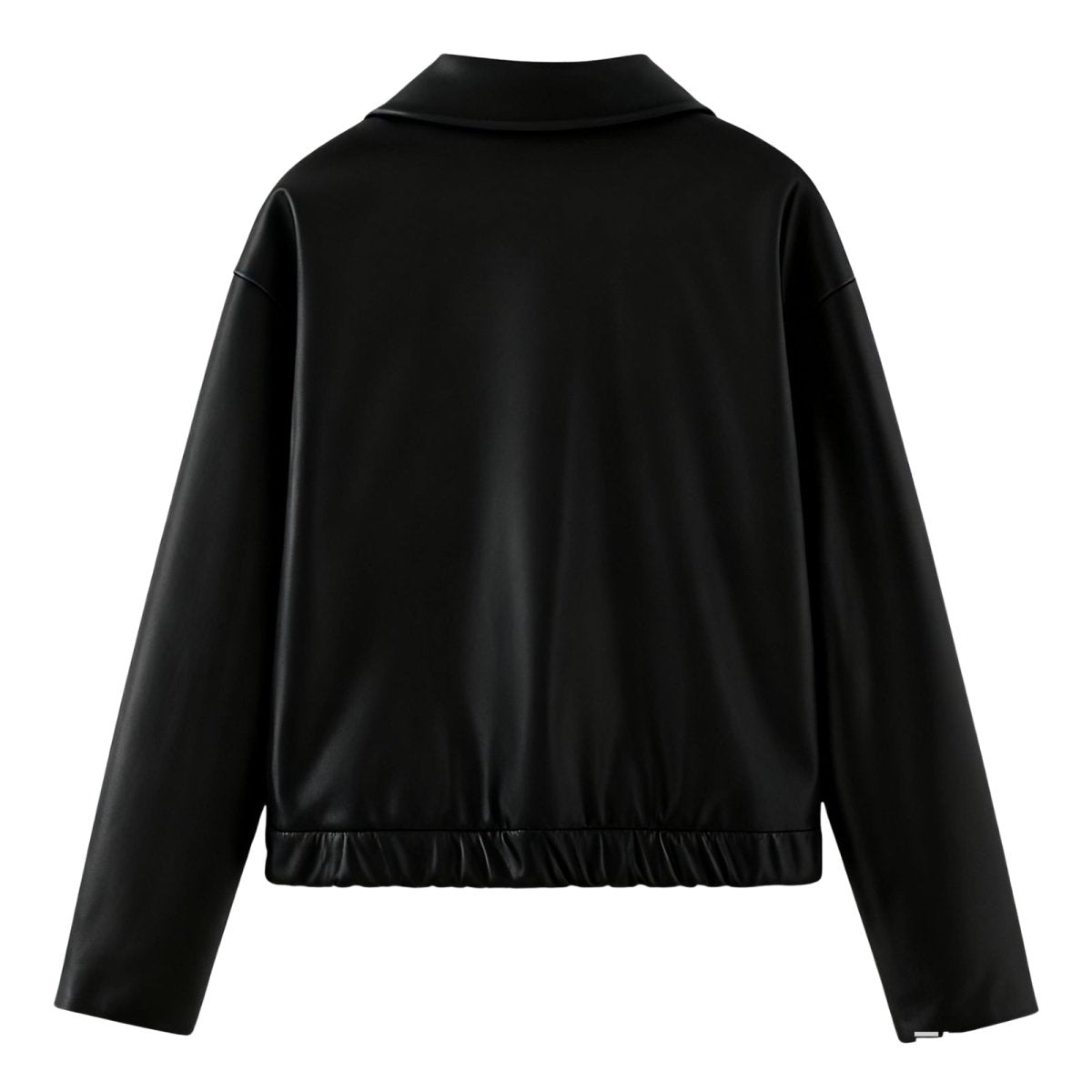 Model facing forward wearing the Kouvr Rosalind black faux leather bomber jacket with hands on hips.