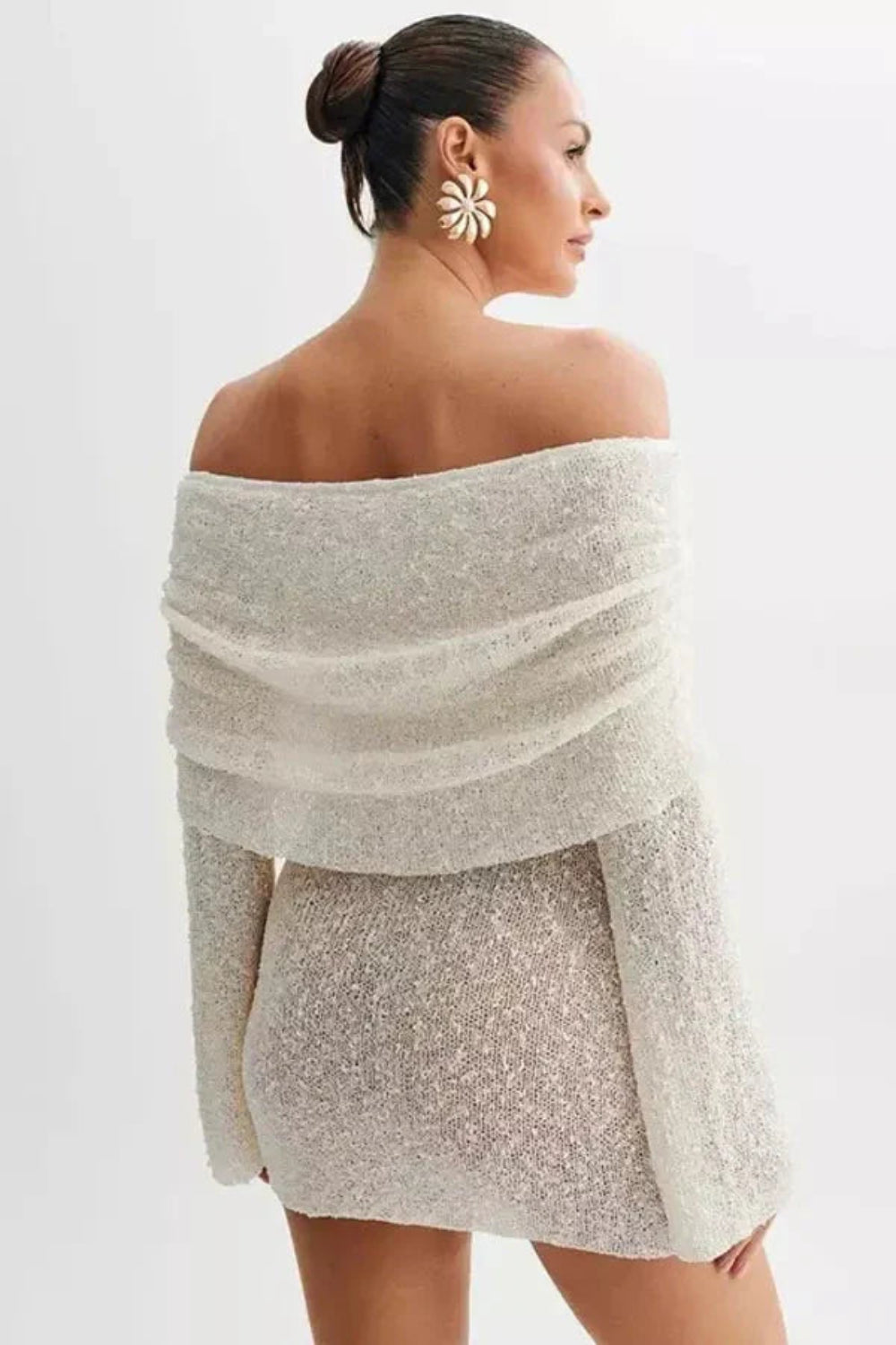 luxe knitwear', 'evening attire', 'sculptural silhouette', 'minimalist glamour', 'date night outfit', 'form-fitting', 'draped neckline