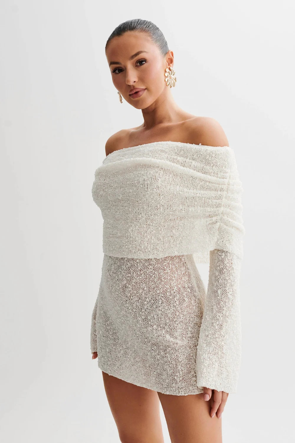 luxe knitwear', 'evening attire', 'sculptural silhouette', 'minimalist glamour', 'date night outfit', 'form-fitting', 'draped neckline