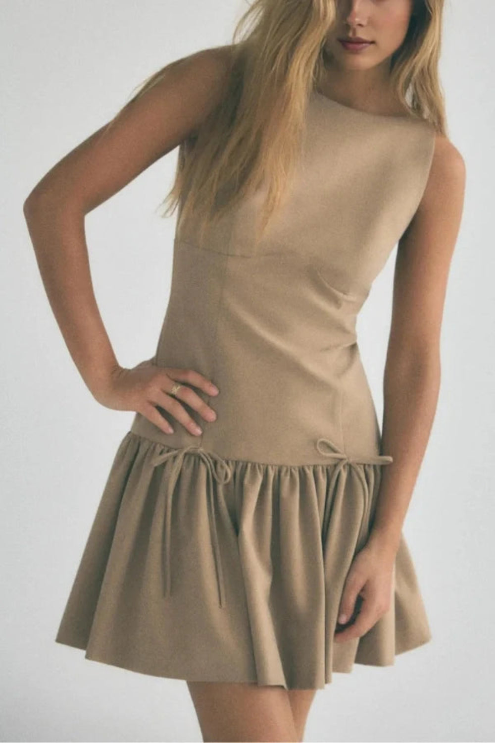 minimalist," "architectural," "modern," "fit and flare," "flounce hem," "day-to-night," and "structured fit